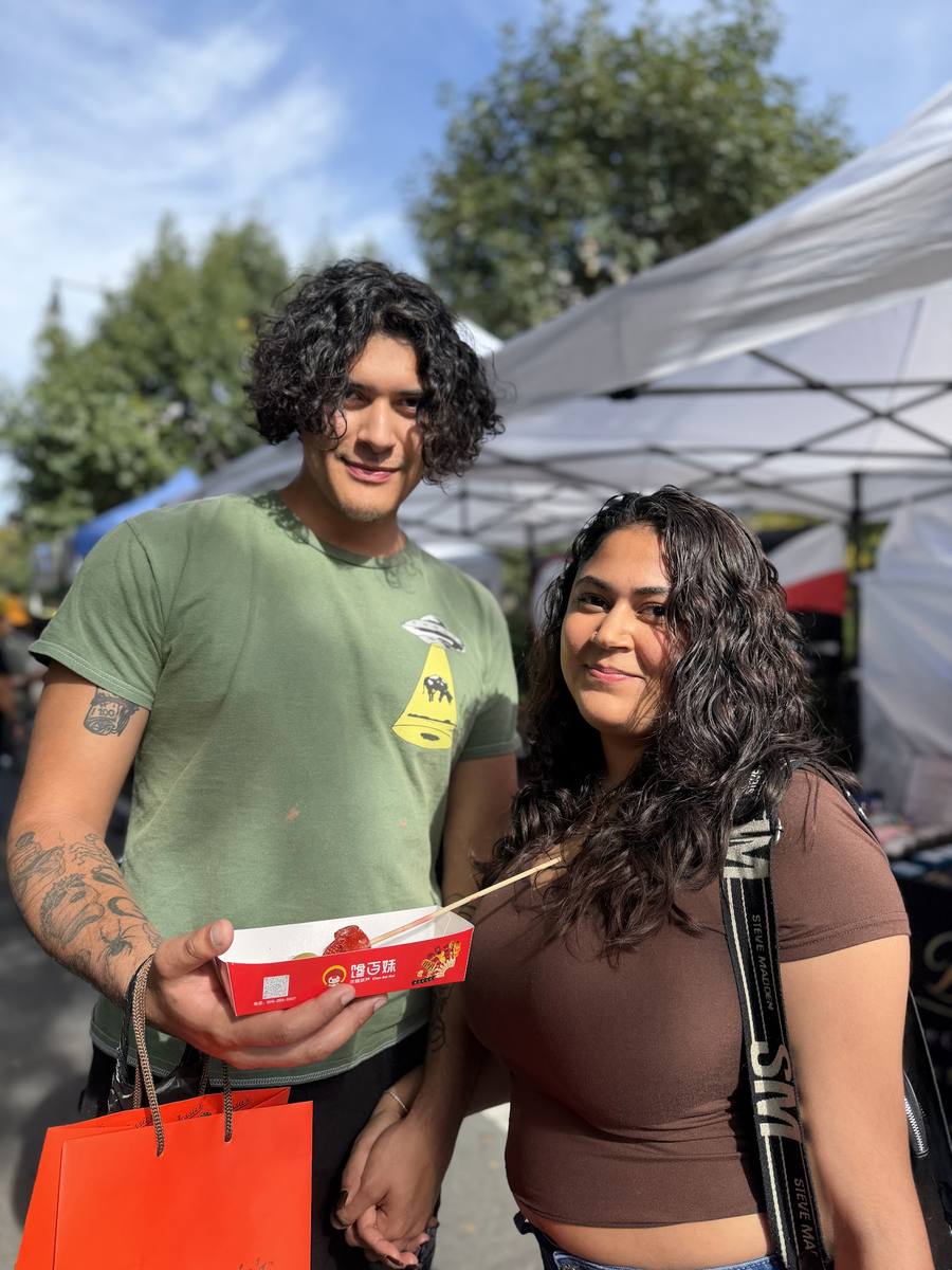 A couple sharing a takeout box